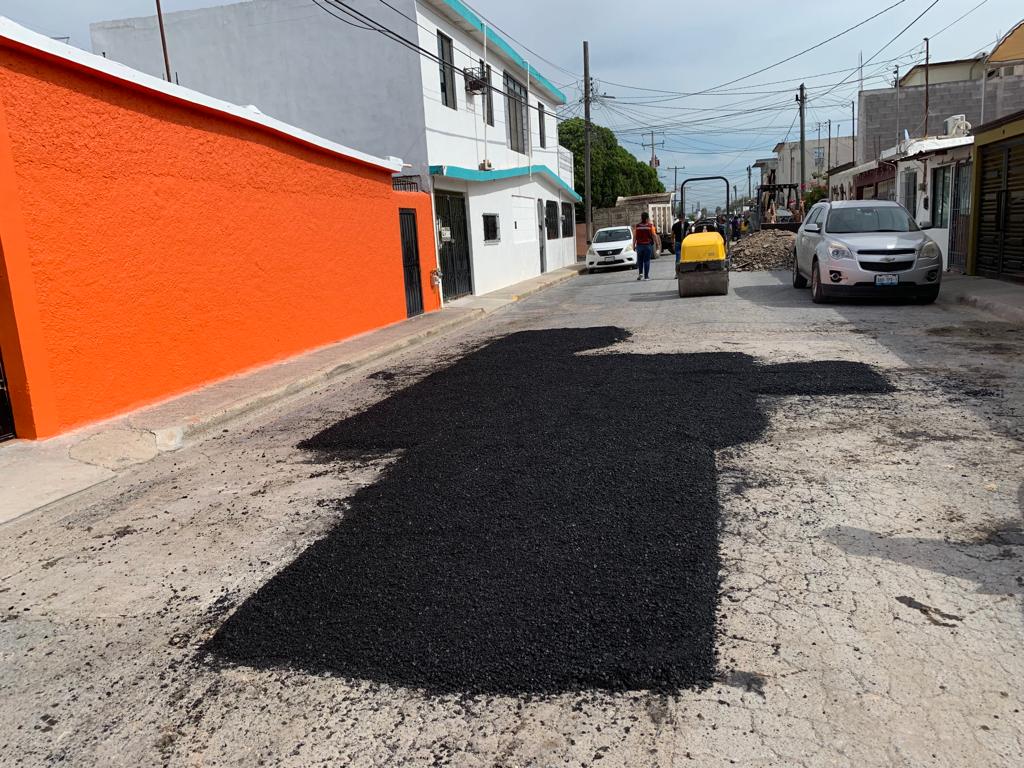 a street with cars and buildings