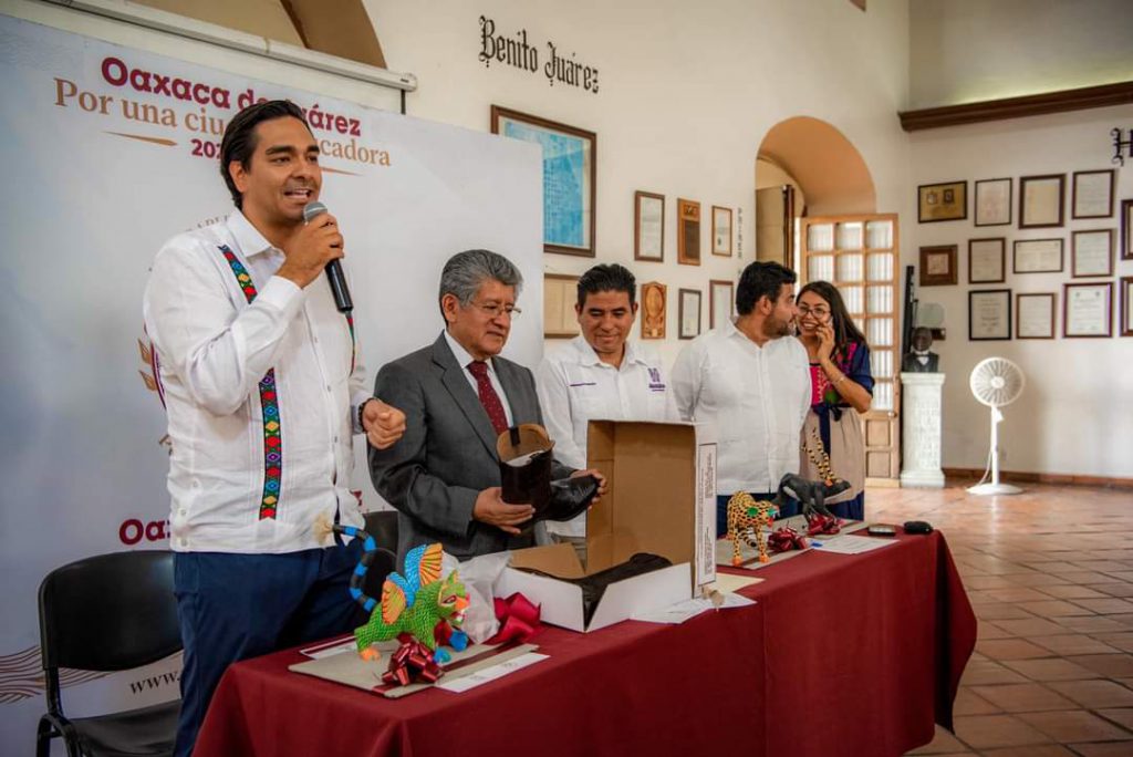 Neri Martínez et al. in a room