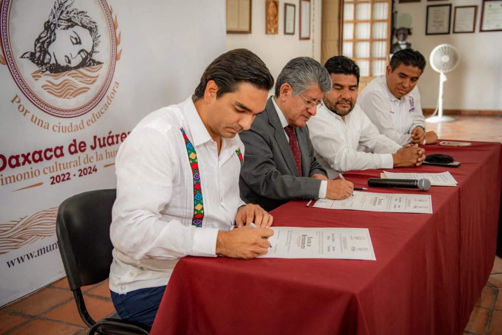 a group of men sitting at a table looking at papers